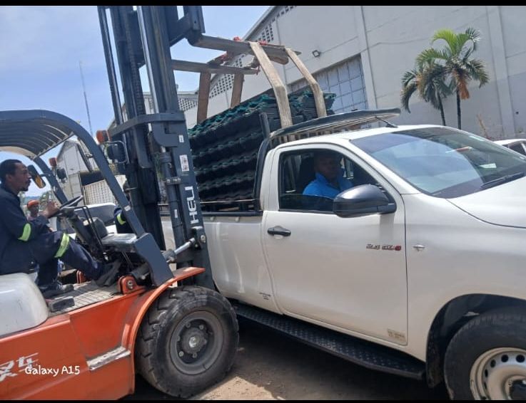 Delivery truck transporting mabati roofing sheets in Kenya